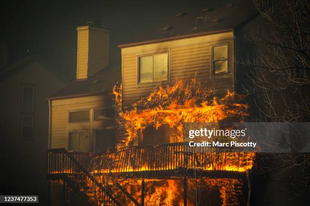 Home burns after a fast moving wildfire swept through the area in the Centennial Heights neighborhood of Louisville, Colorado on December 30, 2021....