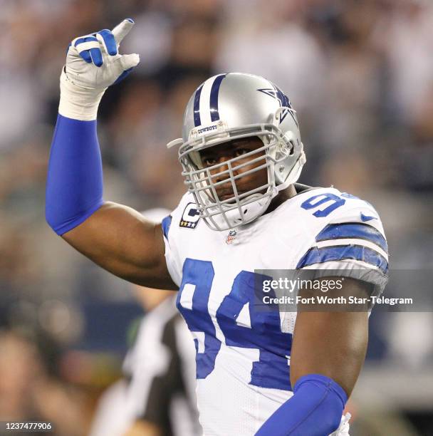 Dallas Cowboys linebacker DeMarcus Ware celebrates after he sacked Philadelphia Eagles Nick Foles in the first quarter at Cowboys Stadium in...