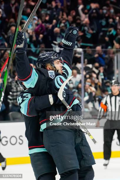Mark Giordano of the Seattle Kraken celebrates after scoring a goal against the Calgary Flames during the first period of his first game playing...