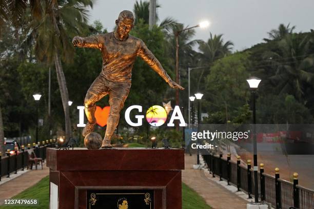 This photograph taken on December 30, 2021 shows a newly installed statue of Portuguese footballer Cristiano Ronaldo in Calangute after the statue...