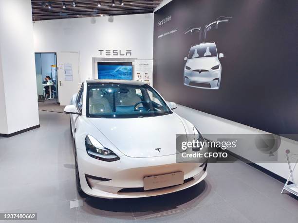 Photo taken on Oct. 31, 2021 shows the Model 3 Model of New energy electric vehicle Tesla brand store in Shanghai, China. December 30, 2021: The...