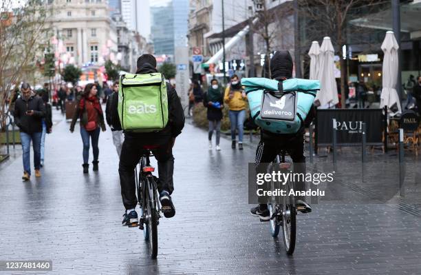 Food delivery services members such as Delivery, UBEReats, Takeaway on duty on December 30, 2021 in Brussels, Belgium. Since the first days of the...