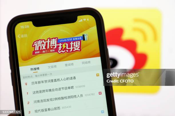 Popular weibo top search queries interface is displayed on a mobile phone, Ganzi City, Sichuan Province, China, December 31, 2021.