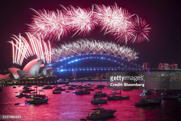 Fireworks by the Sydney Opera House and Sydney Harbour Bridge during New Year celebrations in Sydney, Australia, early on Saturday, Jan. 1, 2022....