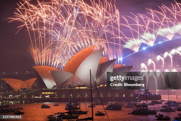 Fireworks by the Sydney Opera House and Sydney Harbour Bridge during New Year celebrations in Sydney, Australia, early on Saturday, Jan. 1, 2022....