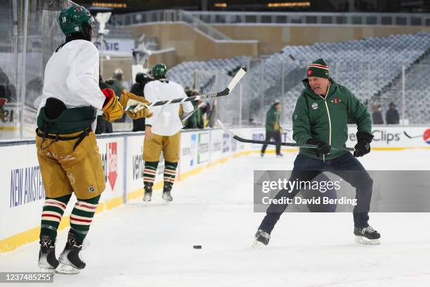 General Manager Bill Guerin and Jordan Greenway of the Minnesota Wild skate during practice at Target Field on December 31, 2021 in Minneapolis,...