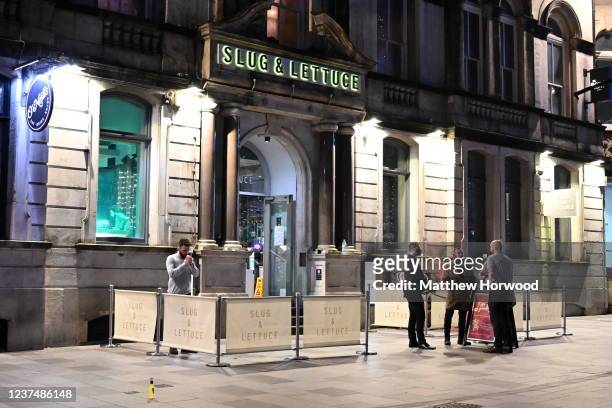 General view of Slug and Lettuce bar on St. Mary Street on December 31, 2021 in Cardiff, Wales. The countries that make up the UK have differing...