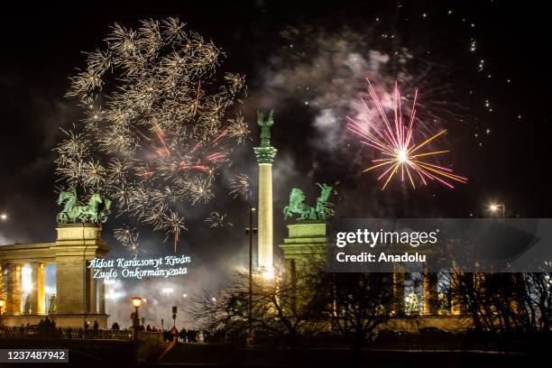 Fireworks light up the night sky over Heroes Square within the new year celebrations in Budapest, Hungary on January 01, 2021.