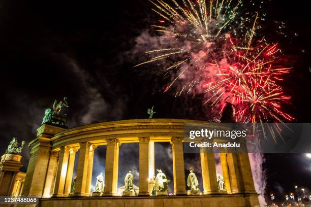 Fireworks light up the night sky over Heroes Square within the new year celebrations in Budapest, Hungary on January 01, 2021.