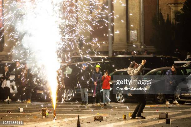 People take part in the new year celebrations at Heroes Square in Budapest, Hungary on January 01, 2021.