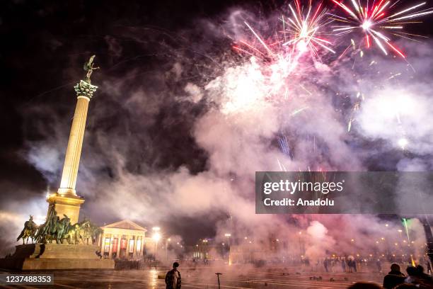 Fireworks light up the night sky over Heroes Square within the new year celebrations in Budapest, Hungary on January 01, 2021.