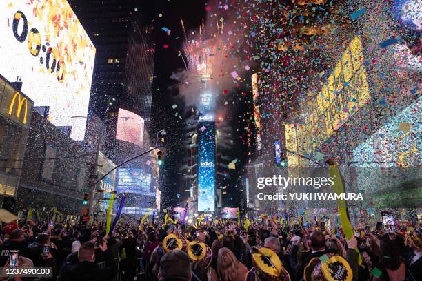 Confetti flies in the air at Times Square on New Year's Eve in New York City on December 31, 2021.