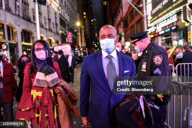 Eric Adams, incoming mayor of New York, right, arrives at a New Year's Eve celebration in the Times Square area of New York, U.S., on Friday, Dec....
