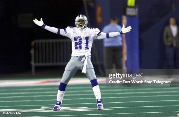 Dallas Cowboys return man Deion Sanders taunts the crowd after a punt by Brad Maynard of the New York Giants went out of bounds on Monday, Oct. 18,...