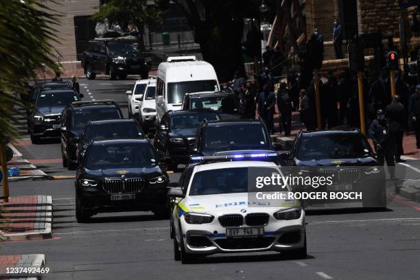 South African President Cyril Ramaphosa's motorcade leaves the St. Georges Cathedral in Cape Town on January 1 after the requiem mass of South...