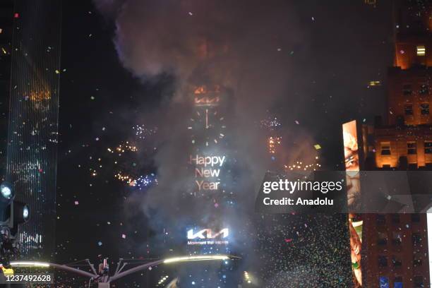 Confetti flies in the air as fireworks explode during the annual ball drop to celebrate the New Year at Times Square in New York City on January 1,...