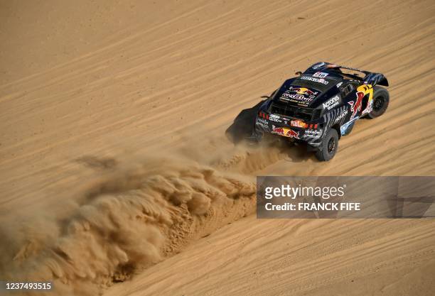 Peugeot's driver French Cyril Desprez and co-driver South African co-driver Perry Taye compete during the Stage 1A of the Dakar Rally 2022 between...
