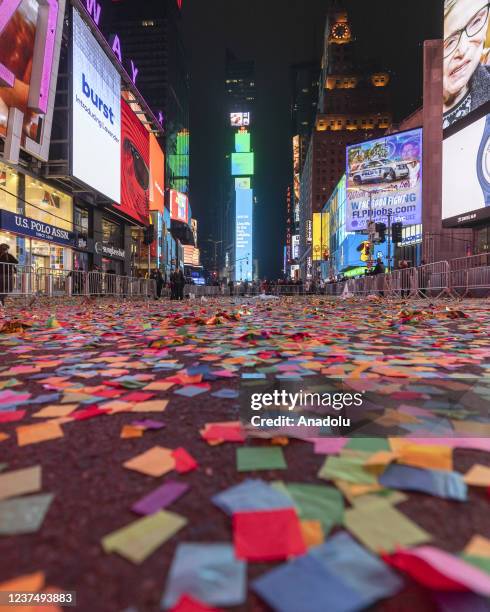 Confetti is seen on the floor as people gather for the annual ball drop to celebrate the New Year at Times Square in New York City on January 1, 2022.