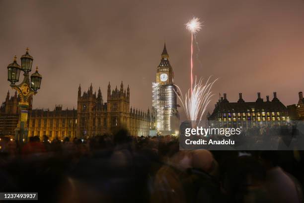 Crowd gather near Westminster Bridge and London Eye to watch fireworks despite police warning as London Eye firework shows cancelled due to the rapid...