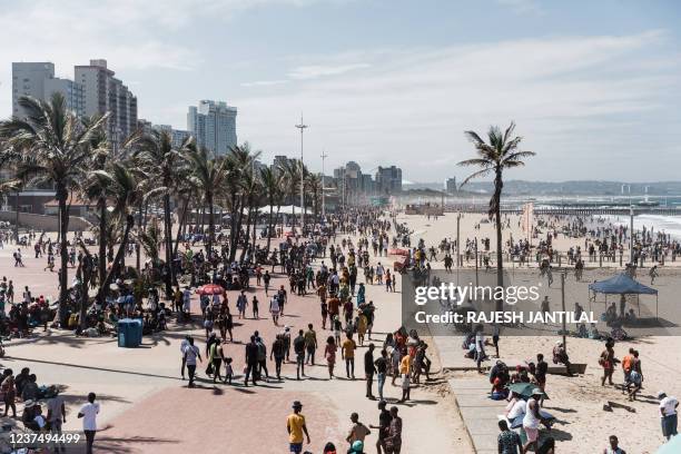 General view taken on January 1, 2022 shows thousands of New Year's day revellers and holidaymakers gathering on the North Beach during New Year...