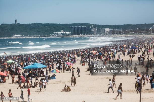 General view taken on January 1, 2022 shows thousands of New Year's day revellers and holidaymakers gathering on the South Beach during New Year...
