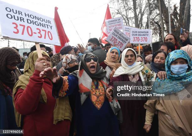 Activists of National Conference shout slogans and hold placards during a protest against the delimitation commission, on January 1, 2022 in...