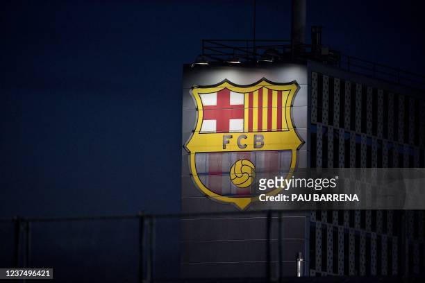 This photo shows the FC Barcelona's logo displayed on a building during a training session in Barcelona on January 1, 2022.