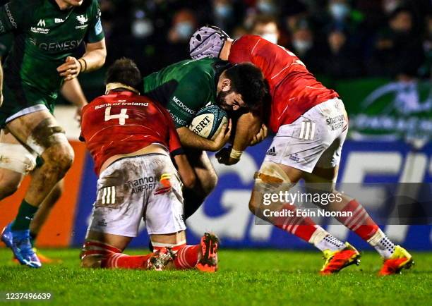 Galway , Ireland - 1 January 2022; Matthew Burke of Connacht is tackled by Jean Kleyn and Fineen Wycherley of Munster during the United Rugby...