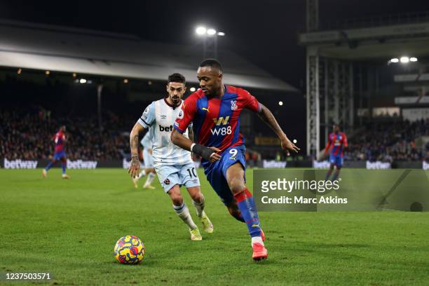 Jordan Ayew of Crystal Palace in action with Manuel Lanzini of West Ham United during the Premier League match between Crystal Palace and West Ham...