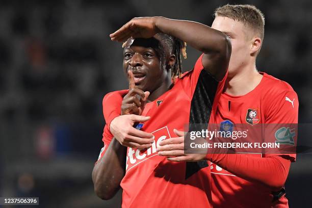 Rennes Belgian forward Jeremy Doku celebrates after scoring a goal during the French cup round of 32 football match between Nancy and Rennes at...