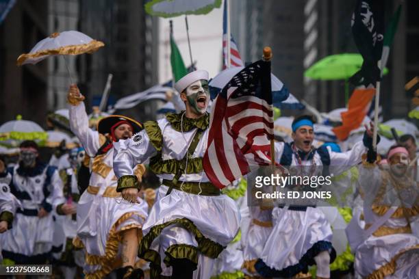 Revellers in fancy dress participate in the annual Mummers Parade in Philadelphia on January 2, 2022. - The Mummers Parade is a 120-year-old folk...