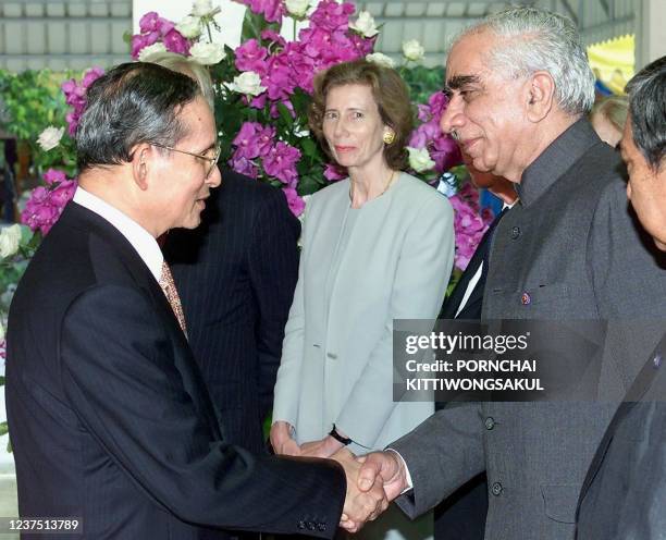 India Foreign Minister Jaswant Singh shakes hands with Thai King Bhumibol Adulyadej 27 July 2000 at Klai Kangwon Palace in Prachaup Kiri Khan, some...