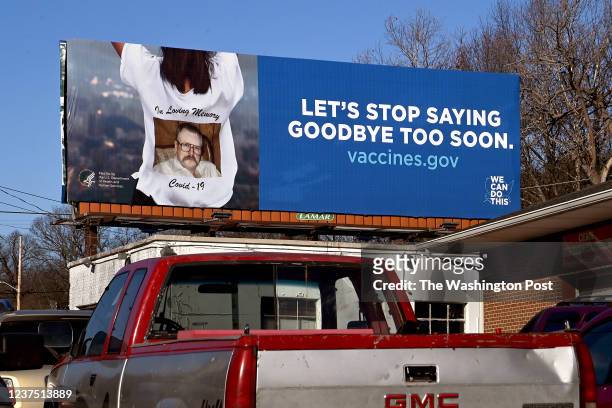 There are Covid-19 related public service billboards all around the area in Roanoke, Virginia on December 12, 2021. The wife and father of...
