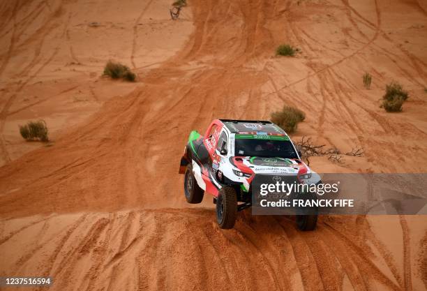 Toyota's driver Yazeed Al Rajhi of Saudi Arabia and co-driver Britain's Michael Orr compete during Stage 2 of the Dakar 2022 between Ha'il and...