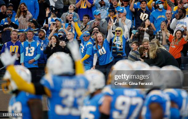 Chargers fans react as the team whoops-up the crowd against the Denver broncos in the second half at SoFi Stadium on January 2, 2022 in El Segundo,...