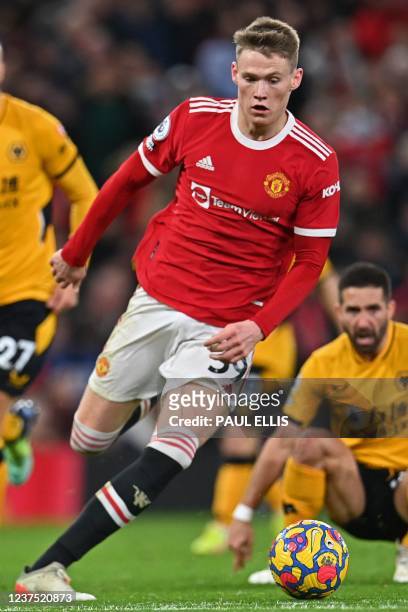 Manchester United's Scottish midfielder Scott McTominay runs with the ball during the English Premier League football match between Manchester United...