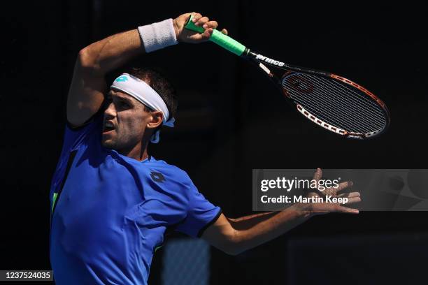 Nicolás Kicker of Argentina hits a forehand during his men's singles round of 32 match against Enzo Couacaud of France during day three of the 2022...