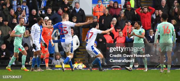 Blackburn Rovers's Lewis Travis has words with Huddersfield Town's Duane Holmes during the Sky Bet Championship match between Blackburn Rovers and...