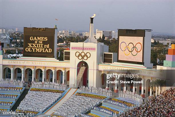 Olympic decathlete gold medallist Rafer Johnson of the United States after climbing the stairs of the Memorial Coliseum prepares to light the Olympic...