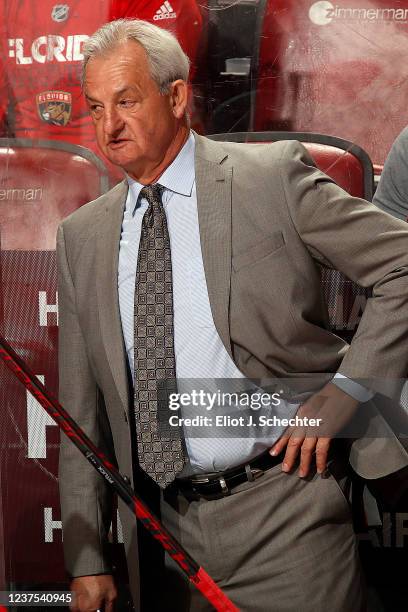 Calgary Flames Head Coach Darryl Sutter monitors game progress from the bench against the Florida Panthers at the FLA Live Arena on January 4, 2022...