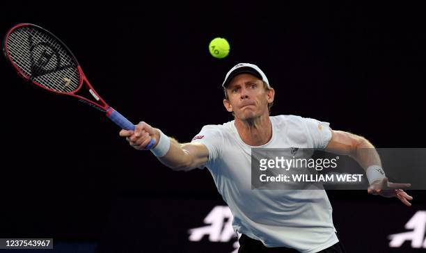 Kevin Anderson of South Africa hits a return during his men's singles match against Jaume Munar of Spain at the Melbourne Summer Set tennis...