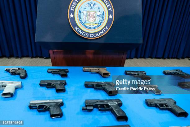 Guns confiscated from gang members on display during Brooklyn District Attorney Eric Gonzalez press conference in District Attorney office. Gonzalez...