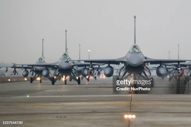 Jet fighters taxis on the runway for an emergency takeoff training at the Air Force base, as the Taiwanese military holds a drill for preparedness...