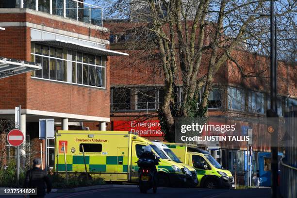 Ambulances are pictured at St George's Hospital in Tooting, south London on January 5, 2022. - Britain's state-run National Health Service is...