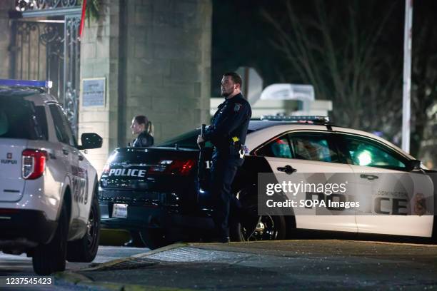 Members of the Indiana University Police backup the Critical Incident Response Team after a homeless man who barricaded himself in a hotel room at...