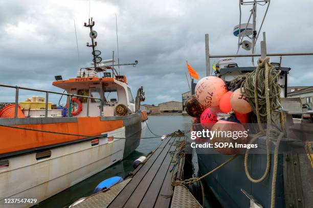 Pontoon of the fishing port of Cherbourg is seen with the equipment and vessels at the dock. The fishing industry in the port of Cherbourg is...