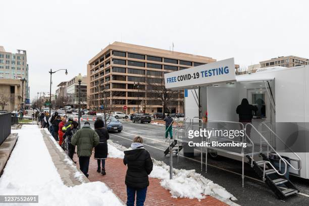 Residents stand in a line to receive Covid-19 PCR tests at a testing site run by the Centers for Disease Control , Federal Emergency Management...