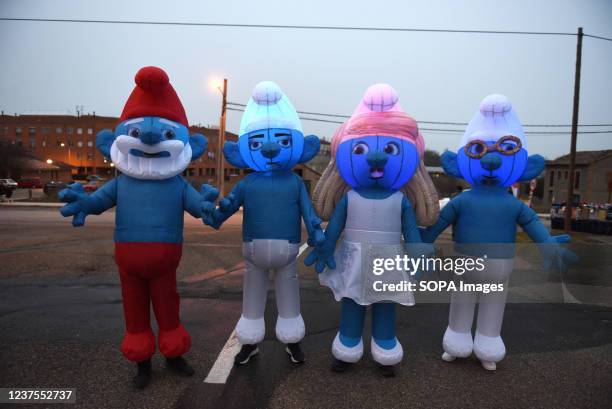 Villagers dressed as Smurfs seen during the Three Kings parade Cabalgata de Reyes. The traditional parade is celebrated around the country during the...
