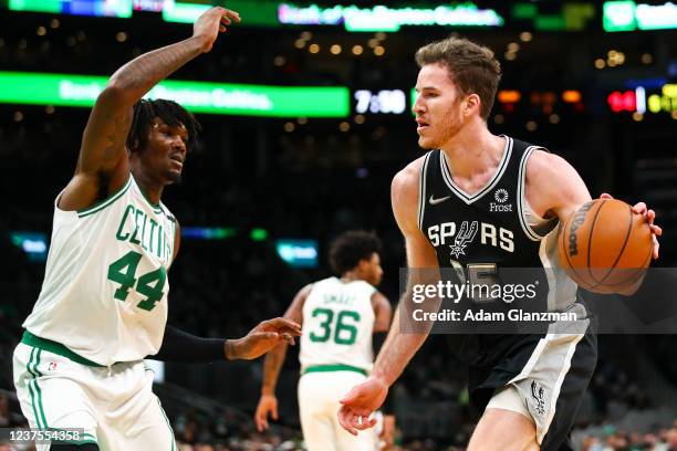 Jakob Poeltl of the San Antonio Spurs drives to the baskey past Robert Williams III of the Boston Celtics during a game at TD Garden on January 5,...