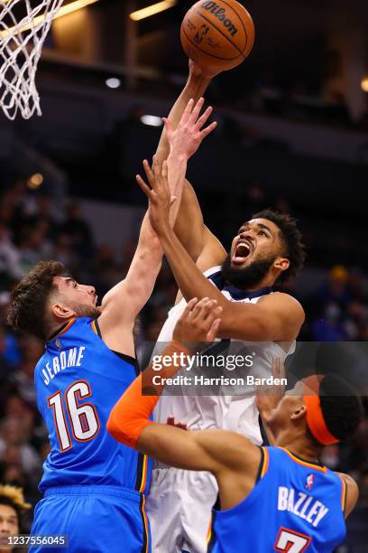 Karl-Anthony Towns of the Minnesota Timberwolves drives to the basket against Ty Jerome of the Oklahoma City Thunder 2during the fourth quarter at...